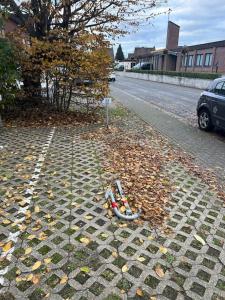 a bike laying on the side of a street at Crazy Home in Hückelhoven