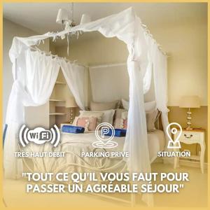 a white bed with a canopy in a bedroom at Fééria - Appartement au calme proche de Disneyland Paris in Chessy