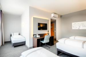 Postel nebo postele na pokoji v ubytování Premier Inn München City Ost