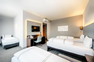 Postel nebo postele na pokoji v ubytování Premier Inn München City Ost