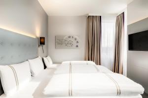Postel nebo postele na pokoji v ubytování Premier Inn München City Ost