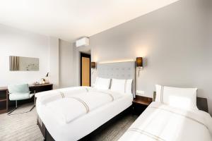 Postel nebo postele na pokoji v ubytování Premier Inn München City Ost