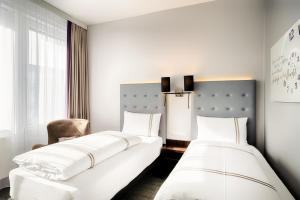 Postel nebo postele na pokoji v ubytování Premier Inn München City Ost