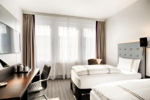Postel nebo postele na pokoji v ubytování Premier Inn München City Ost