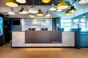 an office with a reception desk and a large at Premier Inn München City Ost in Munich