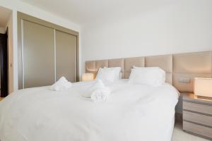 Voodi või voodid majutusasutuse Holiday Apartment La Floresta Elviria toas