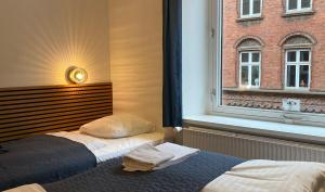 Postel nebo postele na pokoji v ubytování Milling Hotel Mini 11