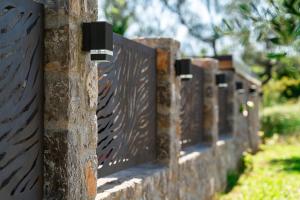 a row of gates on a stone fence at Villa Stemi in Tivat