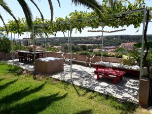 a patio with a couch and a table at Casa Muraglia Studio/Studio Under Castle in Travliáta