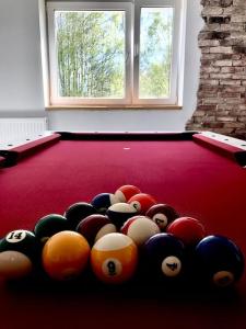a group of billiard balls on a pool table at W Karkonoszach na Chacie #SAUNA # BILARD #LEŚNY PARK in Wojcieszyce