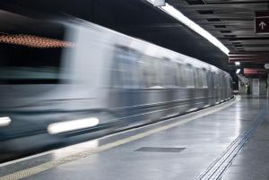 a train is speeding through a subway station at Erossuite GuestHouse in Rome