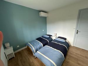 Ένα ή περισσότερα κρεβάτια σε δωμάτιο στο Magnifique Villa proche Golf & Centre d' Hossegor avec Jacuzzi