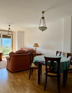 a living room with a couch and a table at Preciosas vistas en el corazón de la Riveira Sacra in Quiroga