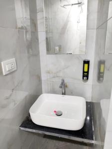 Koupelna v ubytování Hotel Comfy Inn