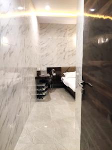 Postel nebo postele na pokoji v ubytování Hotel Comfy Inn