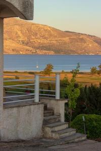 a set of stairs with a view of the water at Koriani Farm Cottage in Lixouri