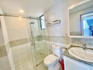a bathroom with a shower and a toilet and a sink at Two Bedroom Happy Residence in Ho Chi Minh City