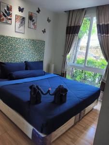 Postel nebo postele na pokoji v ubytování Atlantis condo resort pattaya by Litzaa