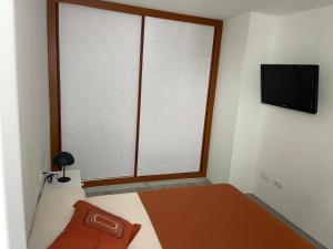 Telewizja i/lub zestaw kina domowego w obiekcie Apartamento Fuerteventura