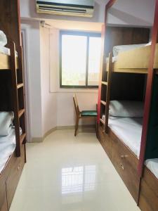 Postel nebo postele na pokoji v ubytování Everest Stays Rooms and Dormitory