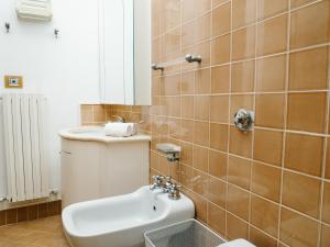 a bathroom with a toilet and a sink at Yuna Rent - Villa Il Vecchio Frantoio in Chieti +83 photos