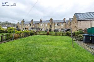 a large yard in front of houses at River Teviot in Hawick