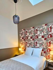 מיטה או מיטות בחדר ב-Appartement Le Bd Haussmann, chic & raffiné !