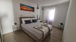 Postel nebo postele na pokoji v ubytování Apartman Joki