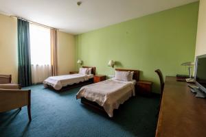 Voodi või voodid majutusasutuse Ararat Hotel toas