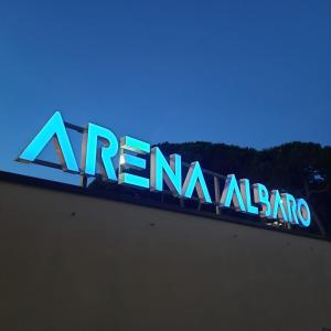 a blue sign on top of a building at Arena Albaro House in Genova