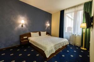 Voodi või voodid majutusasutuse Ararat Hotel toas