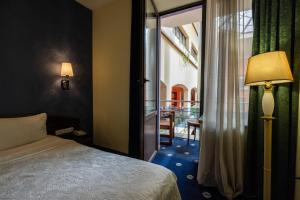 Voodi või voodid majutusasutuse Ararat Hotel toas