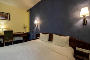 Voodi või voodid majutusasutuse Ararat Hotel toas