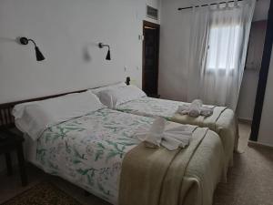 Posteľ alebo postele v izbe v ubytovaní Hotel Rural Don Burguillo
