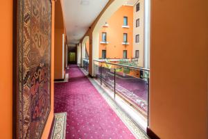 a corridor of a building with purple carpet at Ararat Hotel in Yerevan