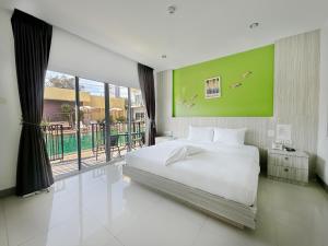Postel nebo postele na pokoji v ubytování Anantra Pattaya Resort + 36 fotografií