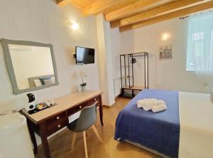 Postel nebo postele na pokoji v ubytování Holmann Suite & Rooms