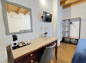 TV a/nebo společenská místnost v ubytování Holmann Suite & Rooms