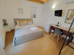 Postel nebo postele na pokoji v ubytování Holmann Suite & Rooms