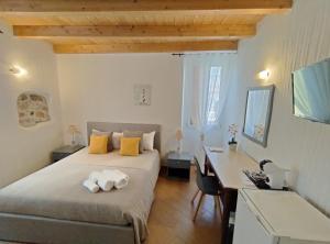 Postel nebo postele na pokoji v ubytování Holmann Suite & Rooms