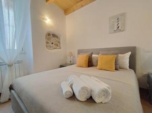 Postel nebo postele na pokoji v ubytování Holmann Suite & Rooms