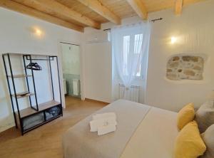 Postel nebo postele na pokoji v ubytování Holmann Suite & Rooms