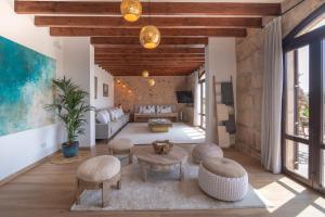 a living room with a couch and a table at Cas Metge Matas in Santa Maria del Camí