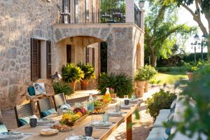 a table set up for a meal on a patio at Cas Metge Matas in Santa Maria del Camí
