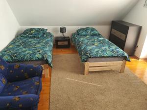 Ένα ή περισσότερα κρεβάτια σε δωμάτιο στο Pokoje Krosno