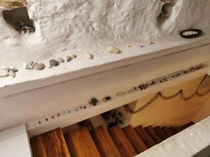a fireplace mantle with rocks and shells on it at Romantic Casa Lorenzina Affittacamere in Ventimiglia