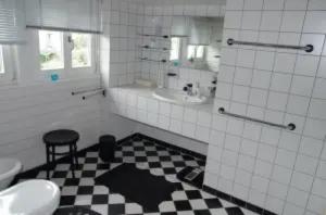 a bathroom with a black and white checkered floor at Ferienhaus Schotten in Schotten