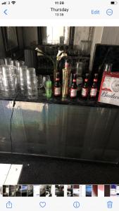 a counter top with a bunch of jars on it at Ardern Hotel in Blackpool
