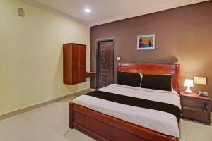 Voodi või voodid majutusasutuse Hotel Ruma Near Nampally Railway Station toas