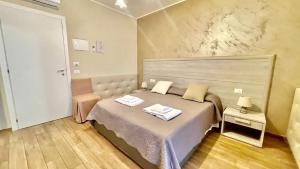 Postel nebo postele na pokoji v ubytování Oasi Perla Del Mare Rooms
